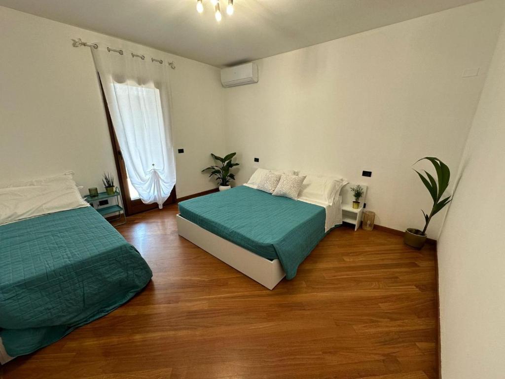 Postel nebo postele na pokoji v ubytování Villa Aurora in Erbusco-Franciacorta