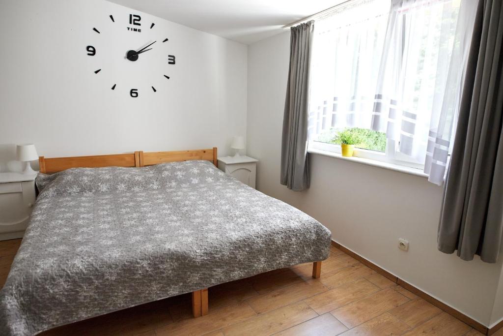 Postel nebo postele na pokoji v ubytování Ośrodek Wypoczynkowy Relaks i Apartamenty