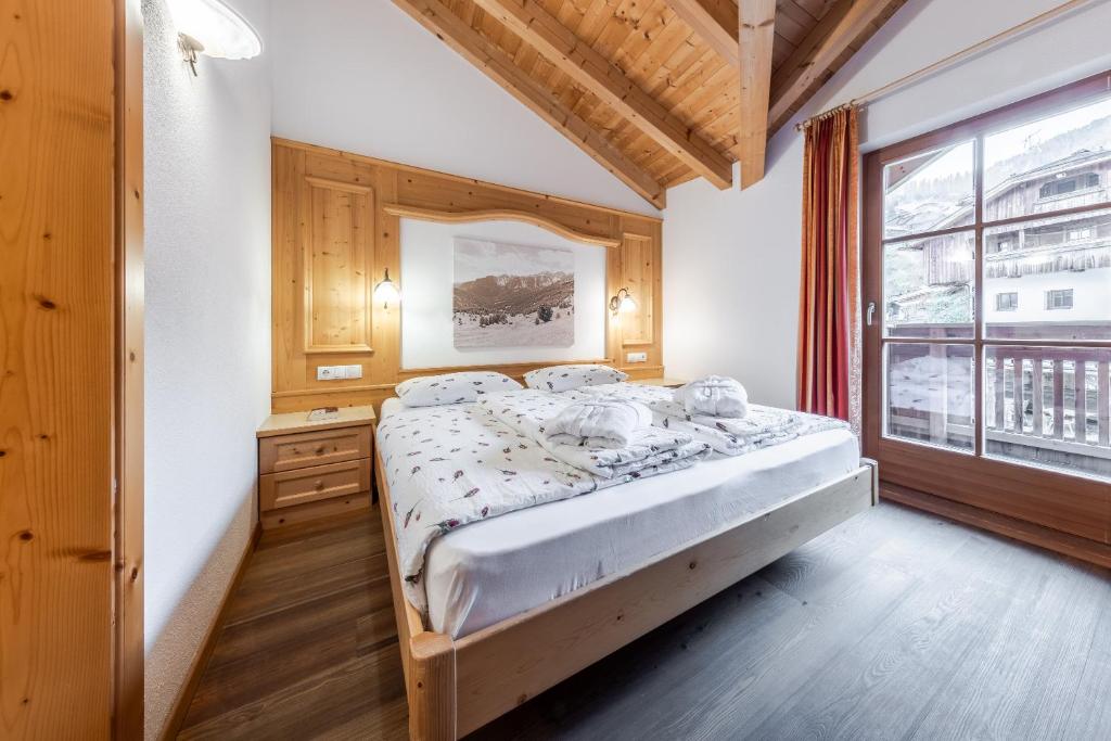 Postel nebo postele na pokoji v ubytování Hotel Pension Odles