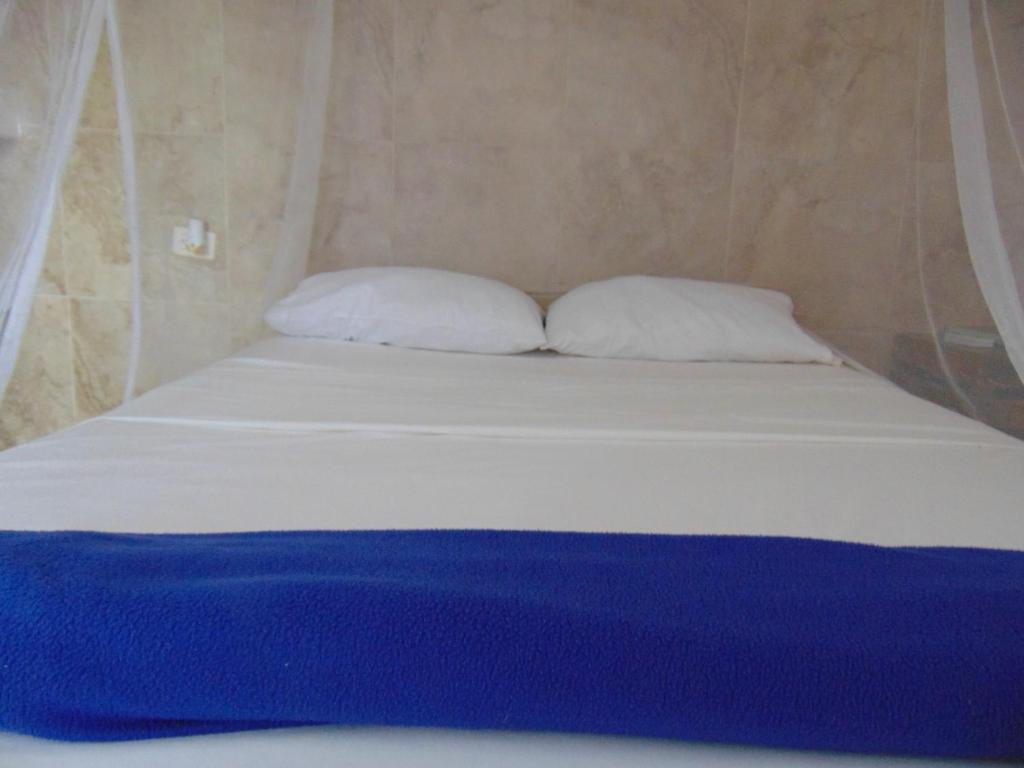 Una cama o camas en una habitación de Dunarinka