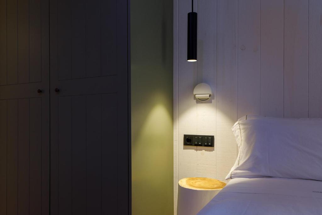 Postel nebo postele na pokoji v ubytování Hostal Olga