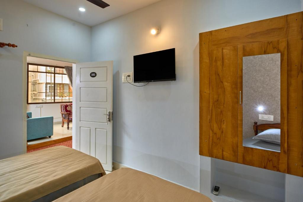 Postel nebo postele na pokoji v ubytování Panakal Residency, Fort Kochi