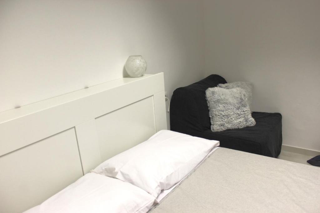 Postel nebo postele na pokoji v ubytování SG Rooms