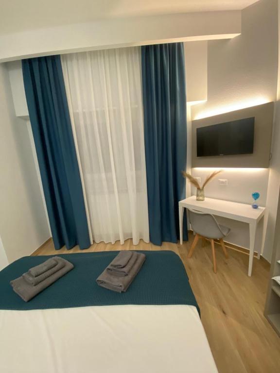 Postel nebo postele na pokoji v ubytování Fla Rooms