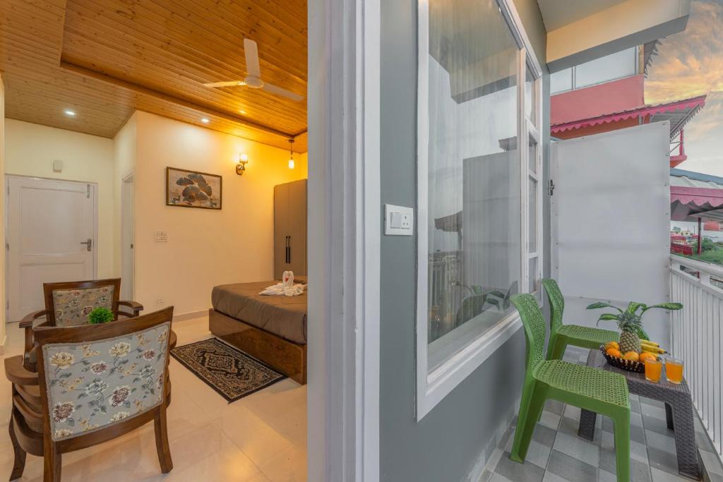 a living room with a view of a bedroom at Kasauli Star View Near Mall Road in Kasauli