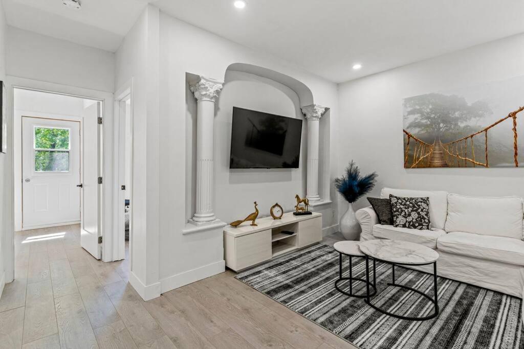a living room with a couch and a table at Appartement haut de gamme NDG in Montreal