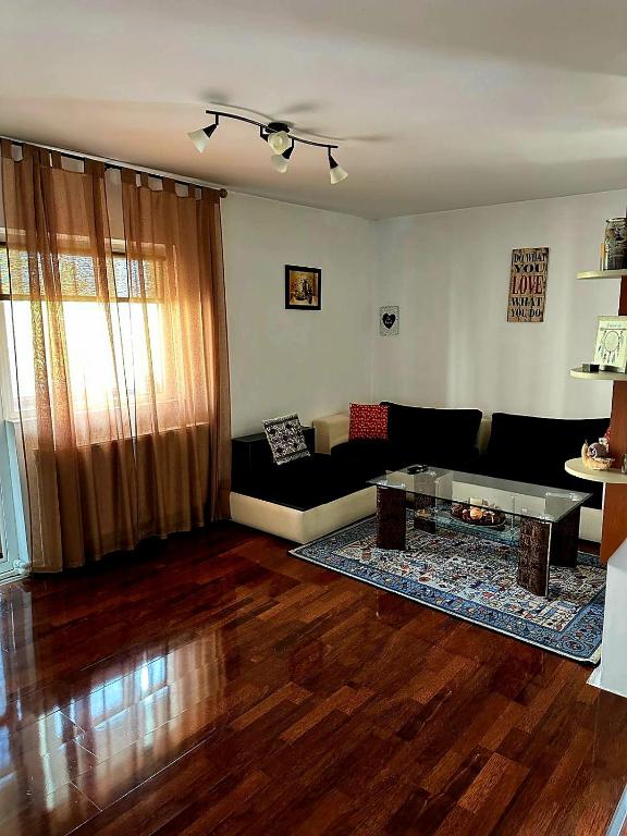 a living room with a couch and a coffee table at Casa Melcilor in Mangalia