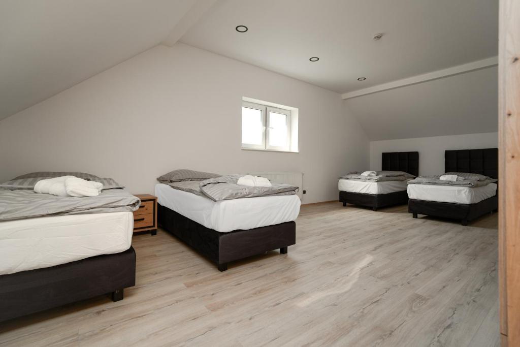 Postel nebo postele na pokoji v ubytování Enjoy apartments