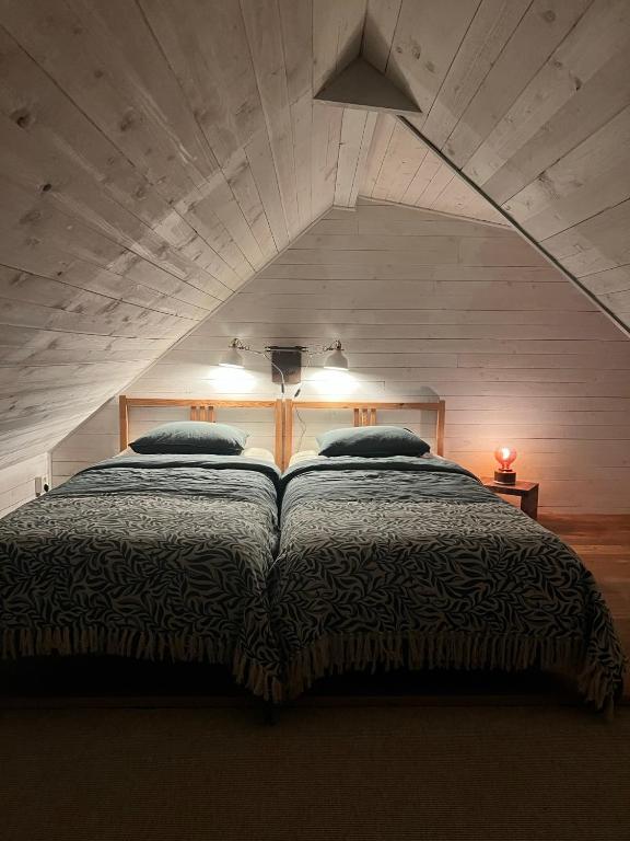 Postel nebo postele na pokoji v ubytování Lilla Huset