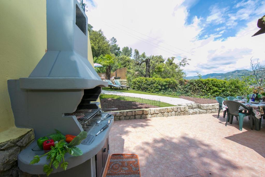 A garden outside Villa Monte Enrico - Pool And Whirlpool - Happy Rentals