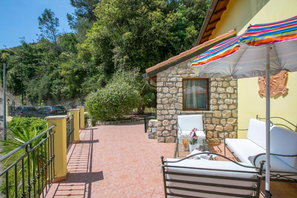 A balcony or terrace at Villa Monte Enrico - Pool And Whirlpool - Happy Rentals