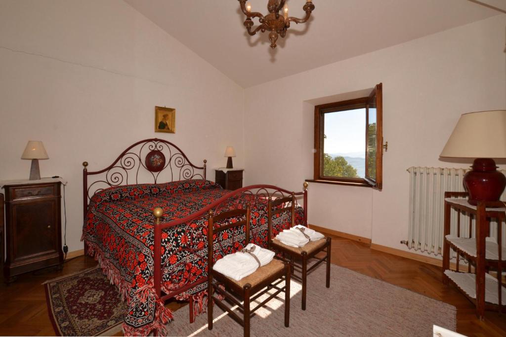 Postel nebo postele na pokoji v ubytování Casale Tigli - Happy Rentals