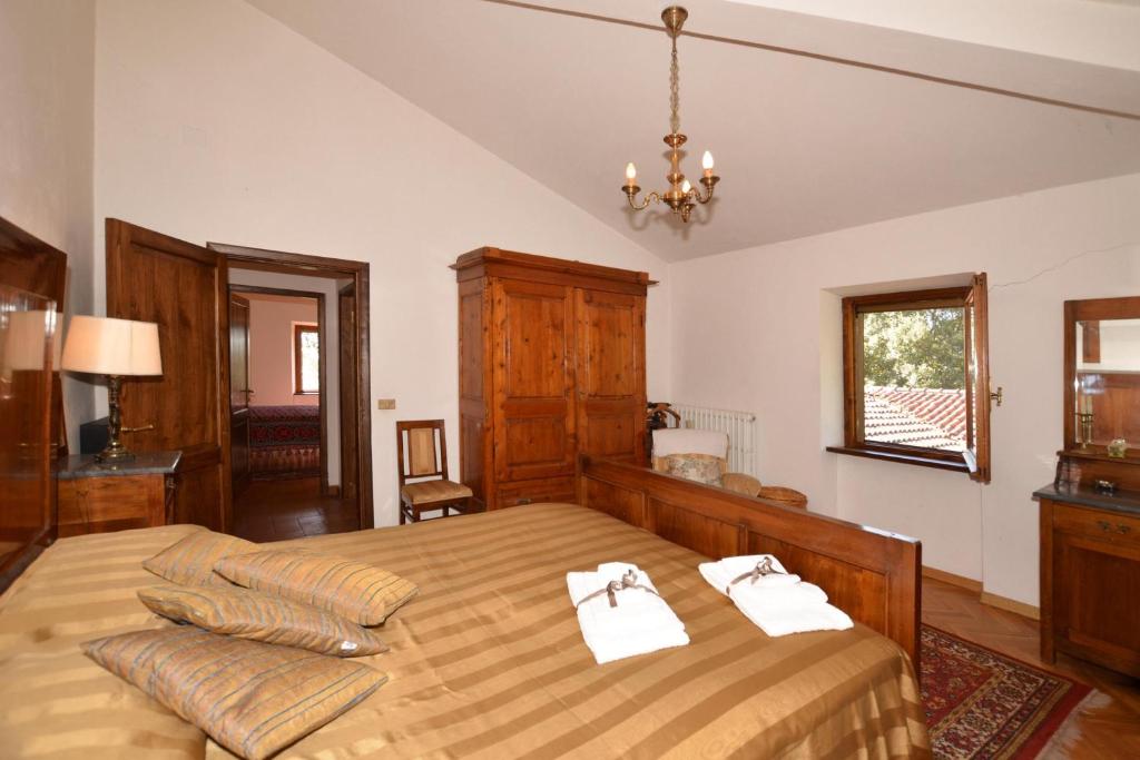 Postel nebo postele na pokoji v ubytování Casale Tigli - Happy Rentals