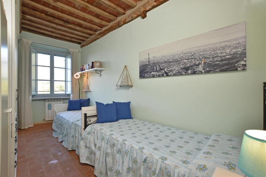 Postel nebo postele na pokoji v ubytování Alloro Grillo - Happy Rentals