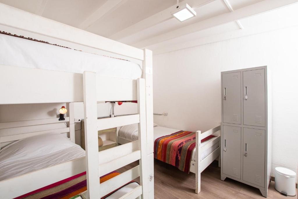 Postel nebo postele na pokoji v ubytování Hostal Copart