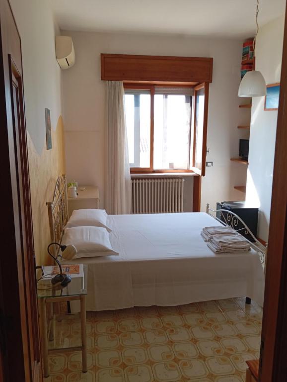 Postel nebo postele na pokoji v ubytování B&B Il Cedro