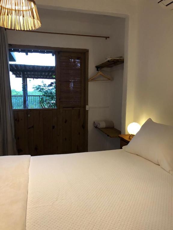 Postel nebo postele na pokoji v ubytování Casa Ocean Trancoso