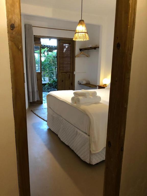 Postel nebo postele na pokoji v ubytování Casa Ocean Trancoso