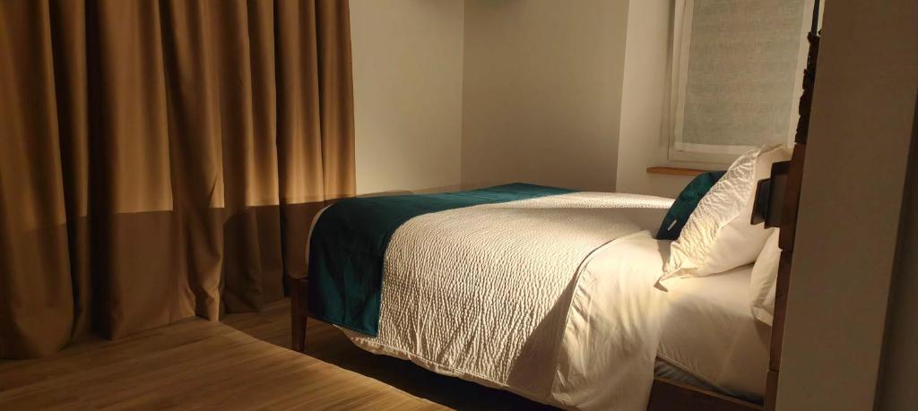 Postel nebo postele na pokoji v ubytování Casa NovecentoSei