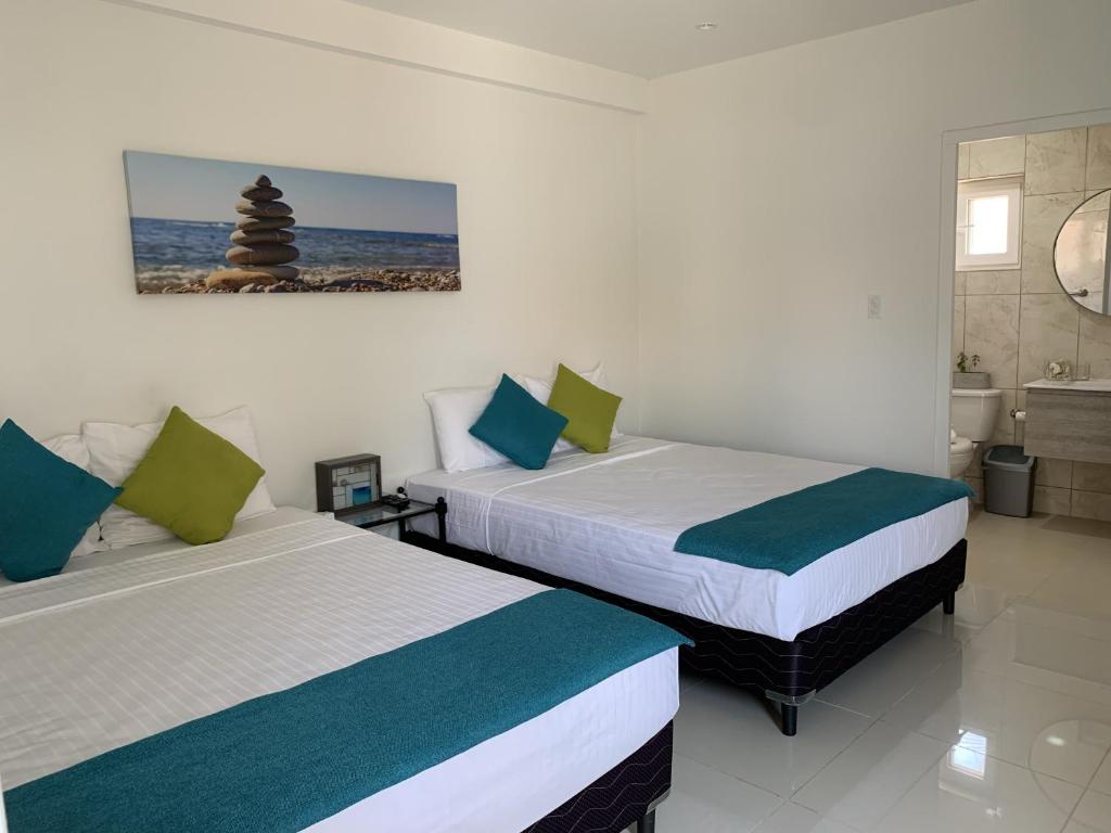 Postel nebo postele na pokoji v ubytování Beach Homes Aruba