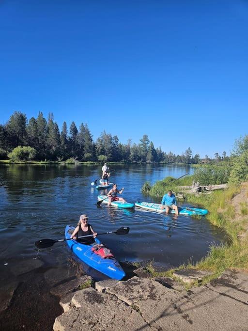 a group of people in kayaks on a river at Beautiful Riverfront Near Mt Bachelor with Hot Tub in Bend