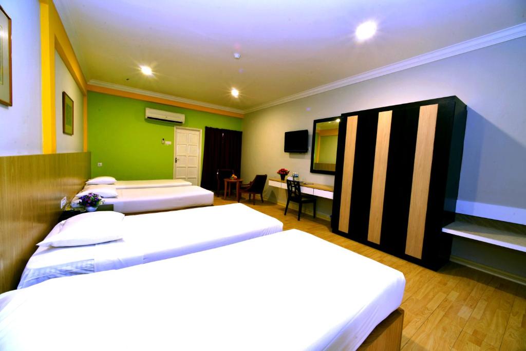 Postel nebo postele na pokoji v ubytování Classic Boutique Hotel Kuantan