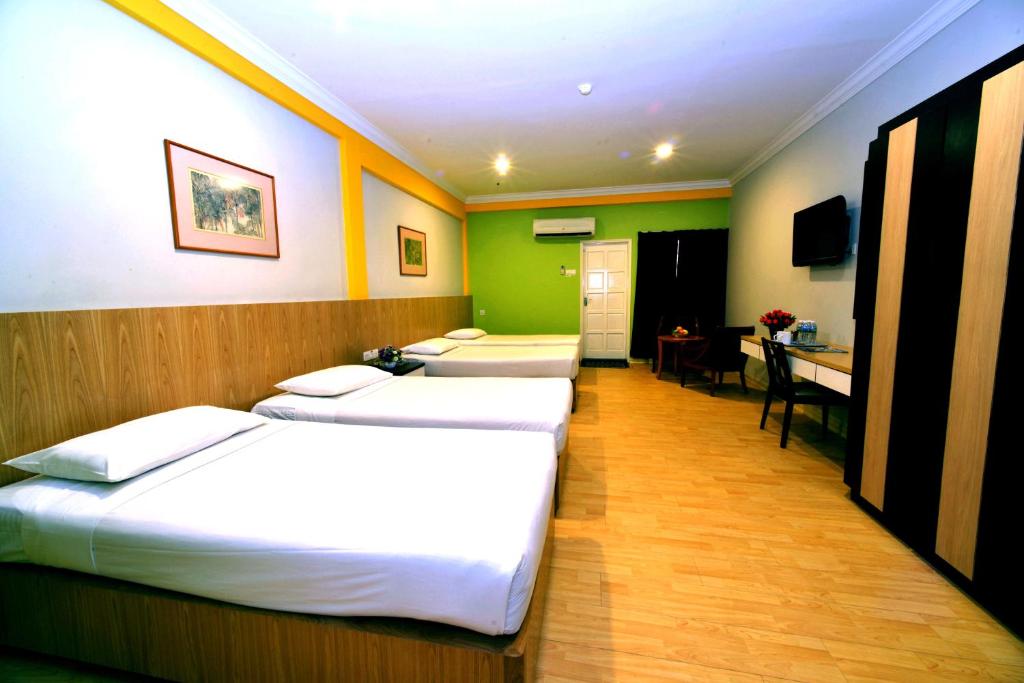 Postel nebo postele na pokoji v ubytování Classic Boutique Hotel Kuantan