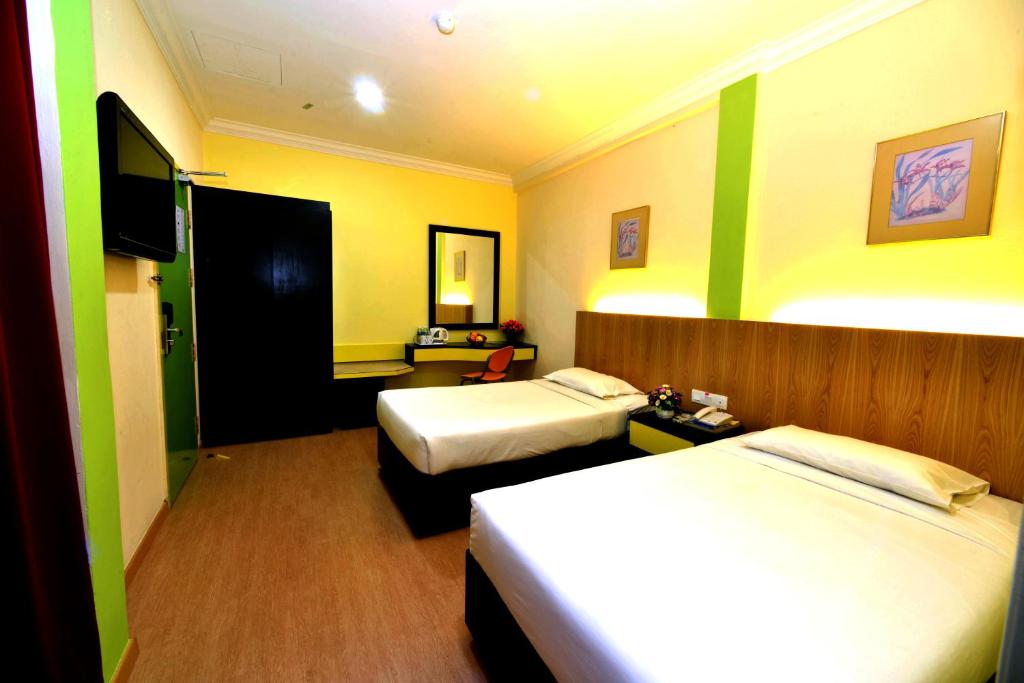 Postel nebo postele na pokoji v ubytování Classic Boutique Hotel Kuantan