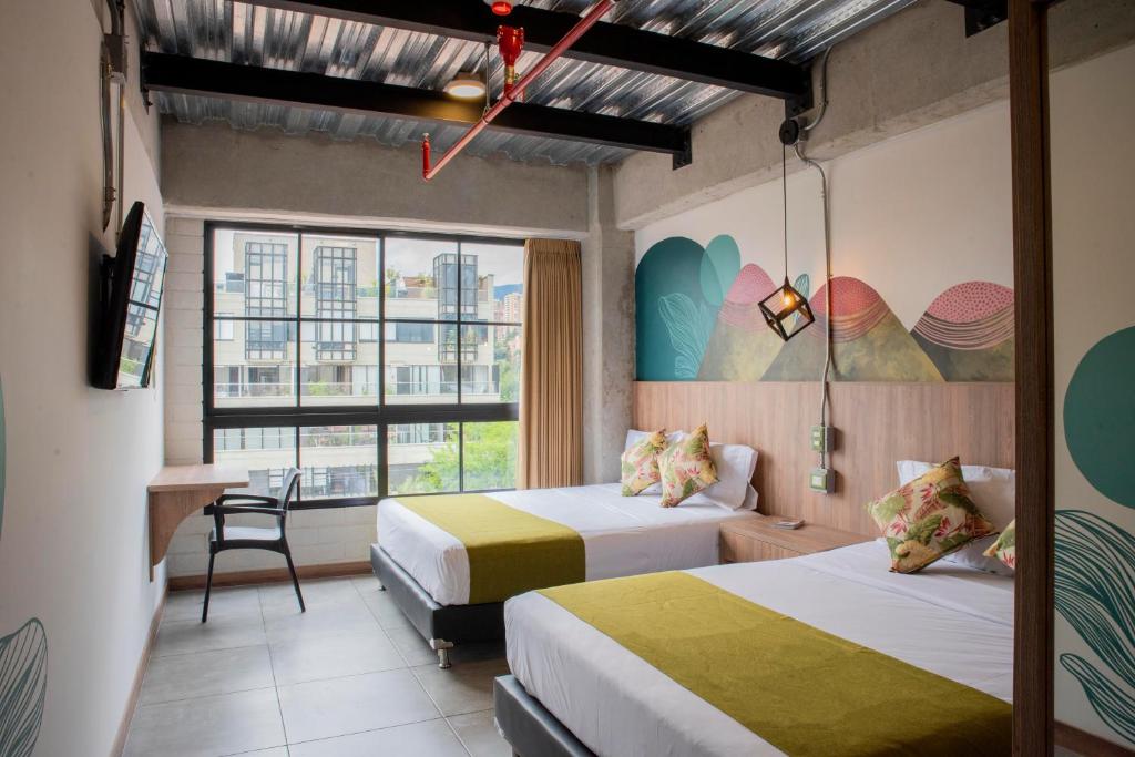 Postel nebo postele na pokoji v ubytování Los Patios Hostel Medellin