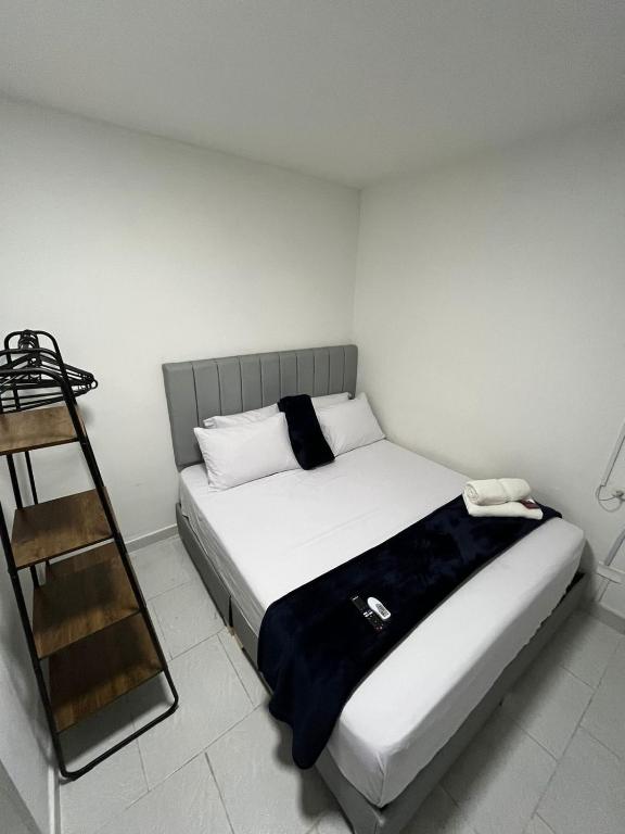 Postel nebo postele na pokoji v ubytování Hotel San Juan 70 Express Medellin