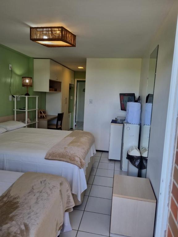 Postel nebo postele na pokoji v ubytování Gran Lençóis Flat Residence