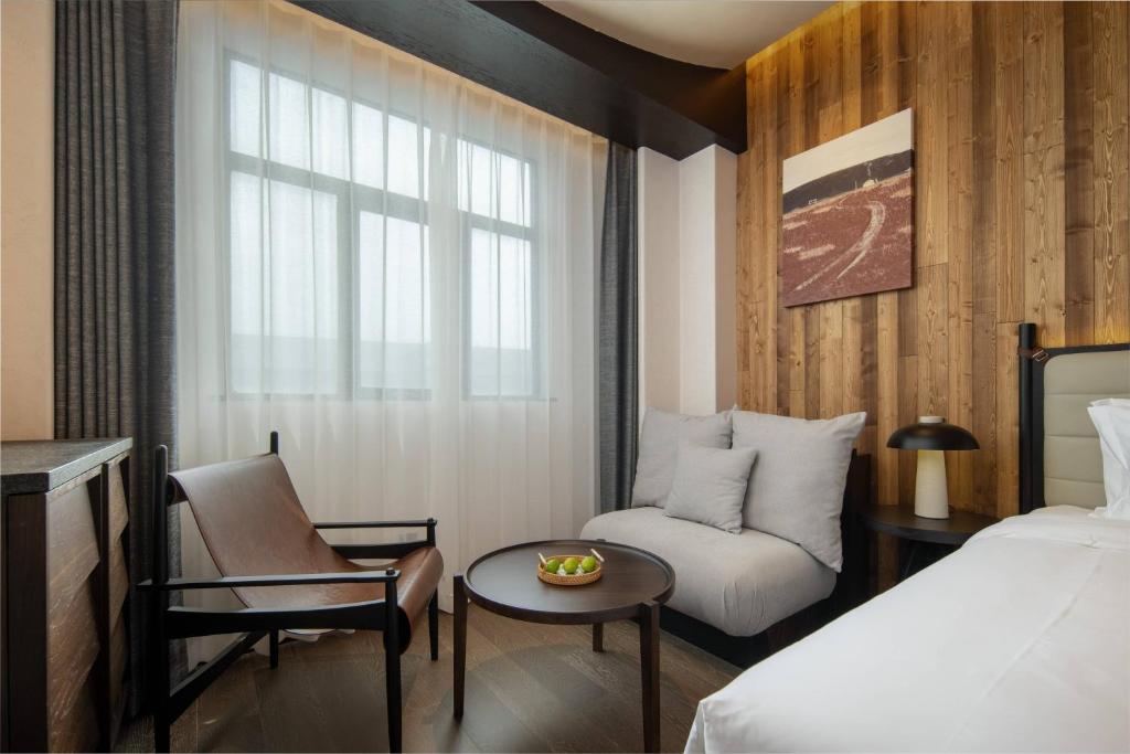 Postel nebo postele na pokoji v ubytování Presidential Palace YiLi Hotel Nanjing