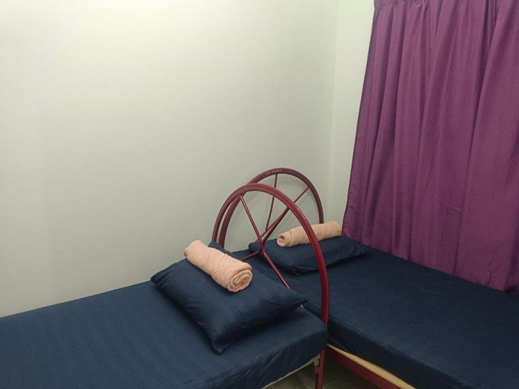 Postel nebo postele na pokoji v ubytování Beyond Homestay, Shah Alam