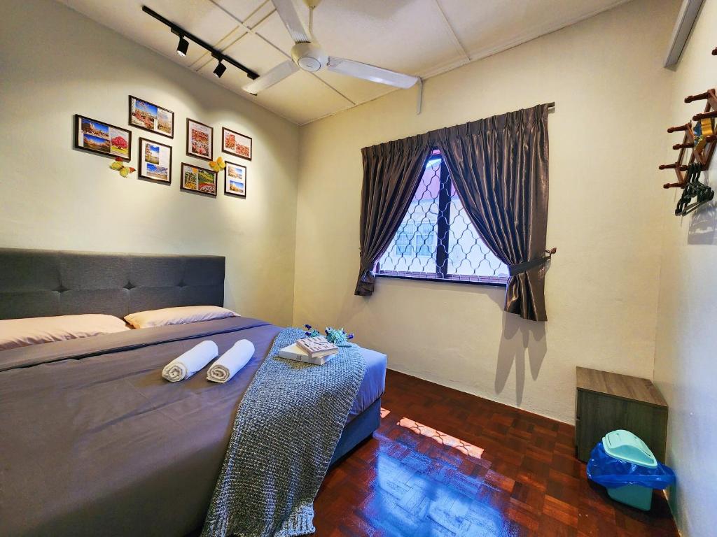 Postel nebo postele na pokoji v ubytování IPOH Rainbow Blissful Villa, Persiaran Halaman AMPANG