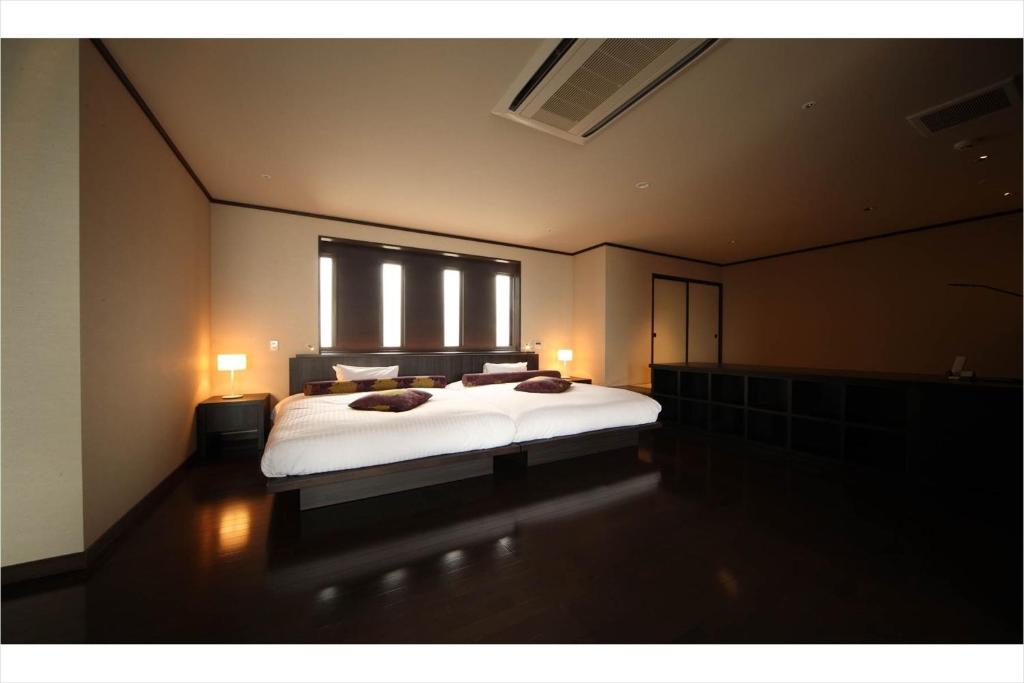 Postel nebo postele na pokoji v ubytování Hotel Amandi