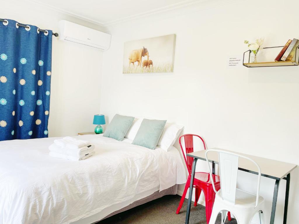 Postel nebo postele na pokoji v ubytování Pupuke Manor Motel