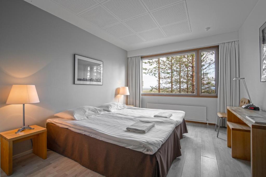 Postel nebo postele na pokoji v ubytování Ski-Inn Hotel Pyhätunturi