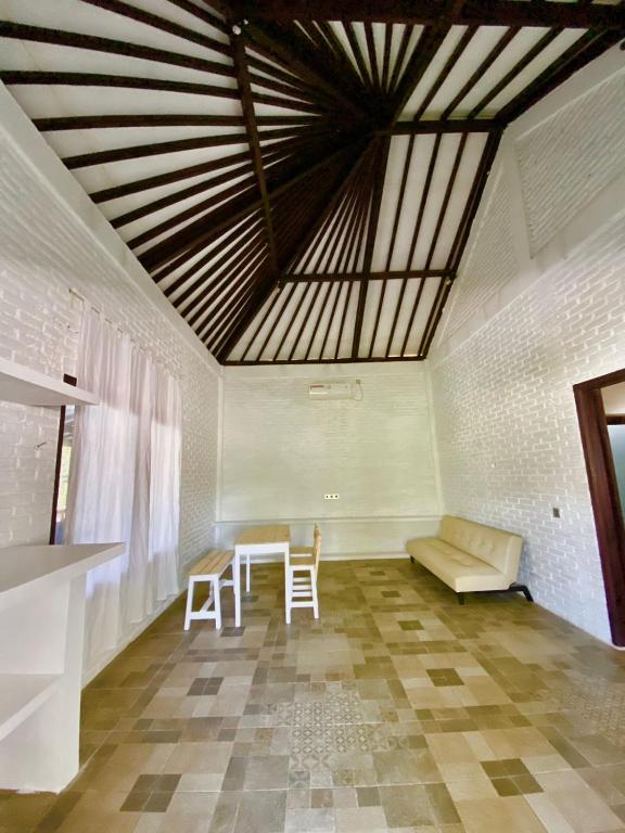 Posezení v ubytování Lazy Inn Kuta Lombok