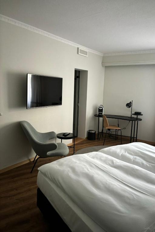 TV a/nebo společenská místnost v ubytování Hotel Luzernerhof