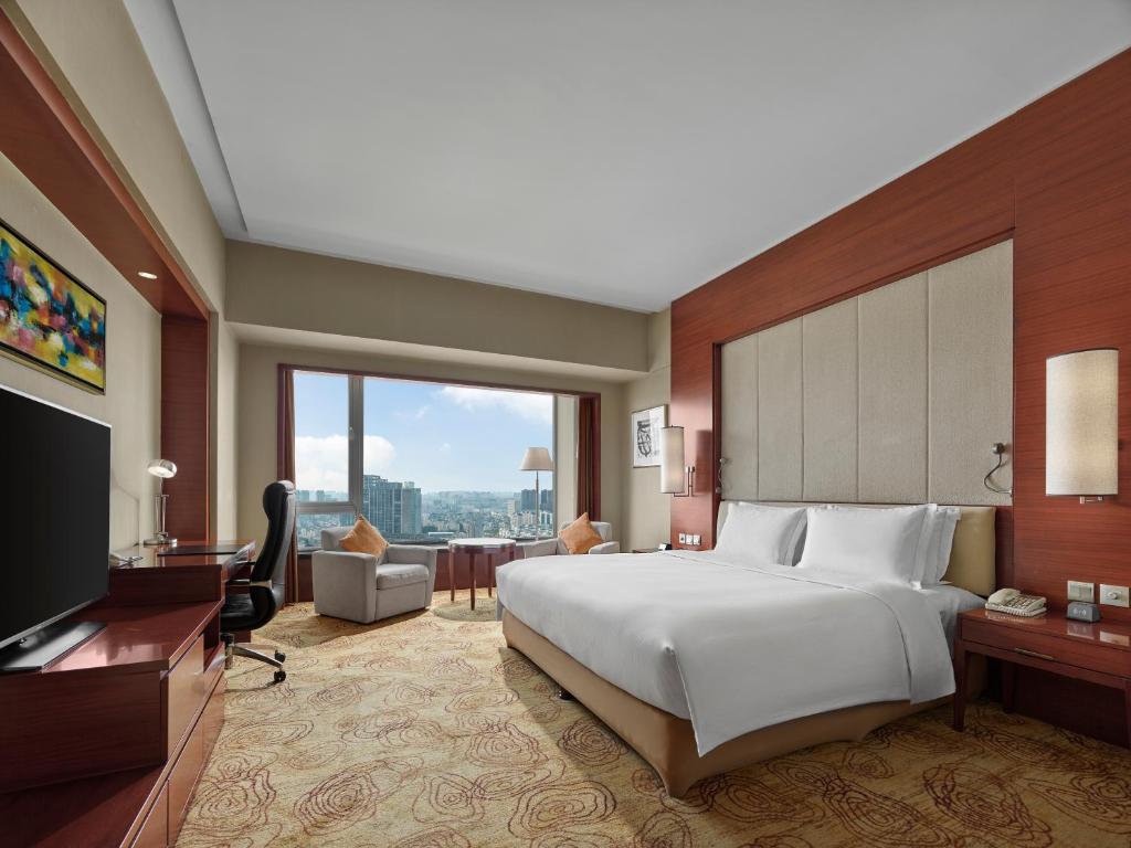 Postel nebo postele na pokoji v ubytování Hilton Hefei