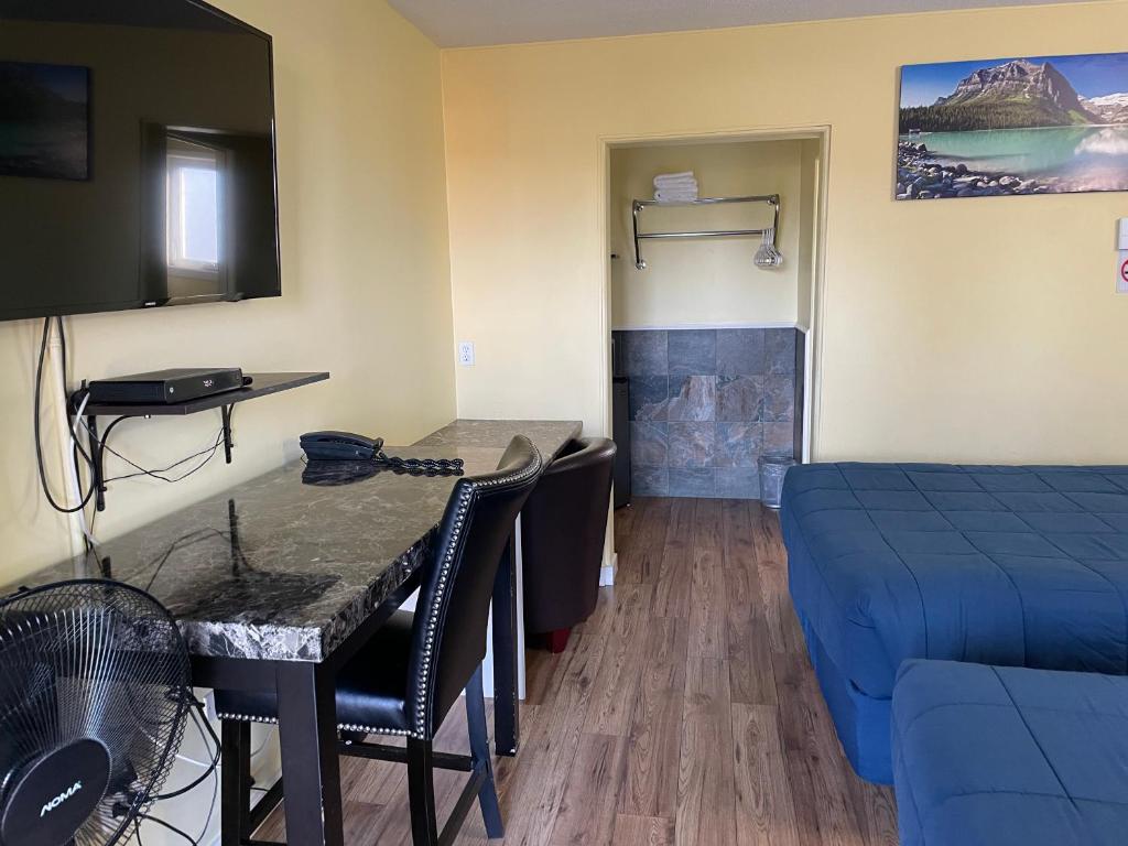 Postel nebo postele na pokoji v ubytování Port-O-Call Inn