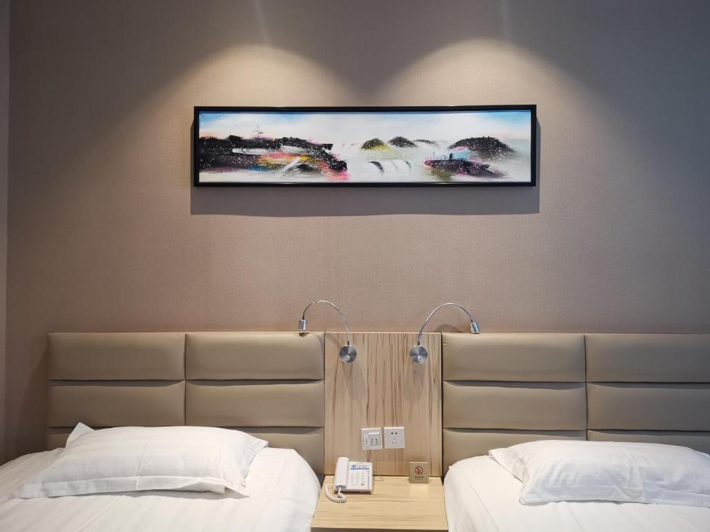 Letto o letti in una camera di Wuxi Fish Inn Rongxiang