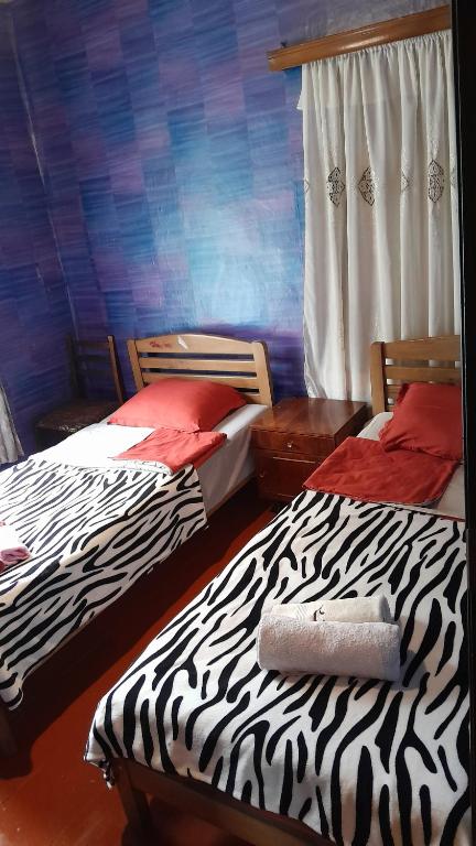 Postel nebo postele na pokoji v ubytování Guest House Tengo