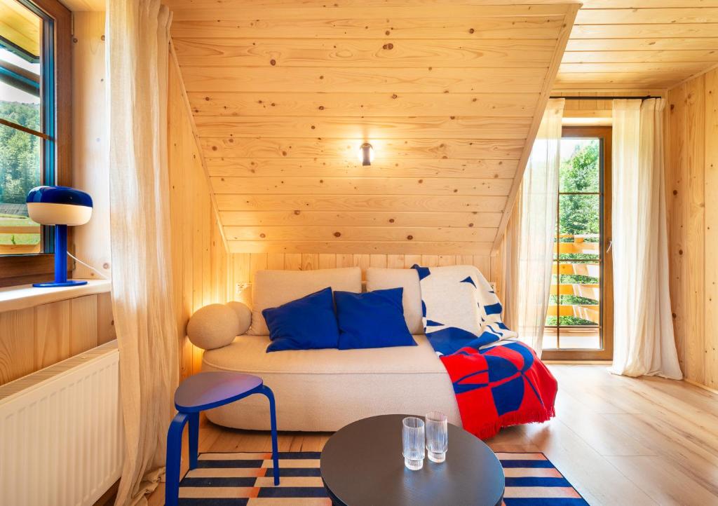 a living room with a couch and a table at Apartamenty & Pokoje MyWy in Zakopane
