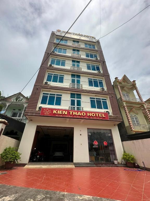 a hotel with a sign on the front of it at Kien Thao Hotel in Ha Giang