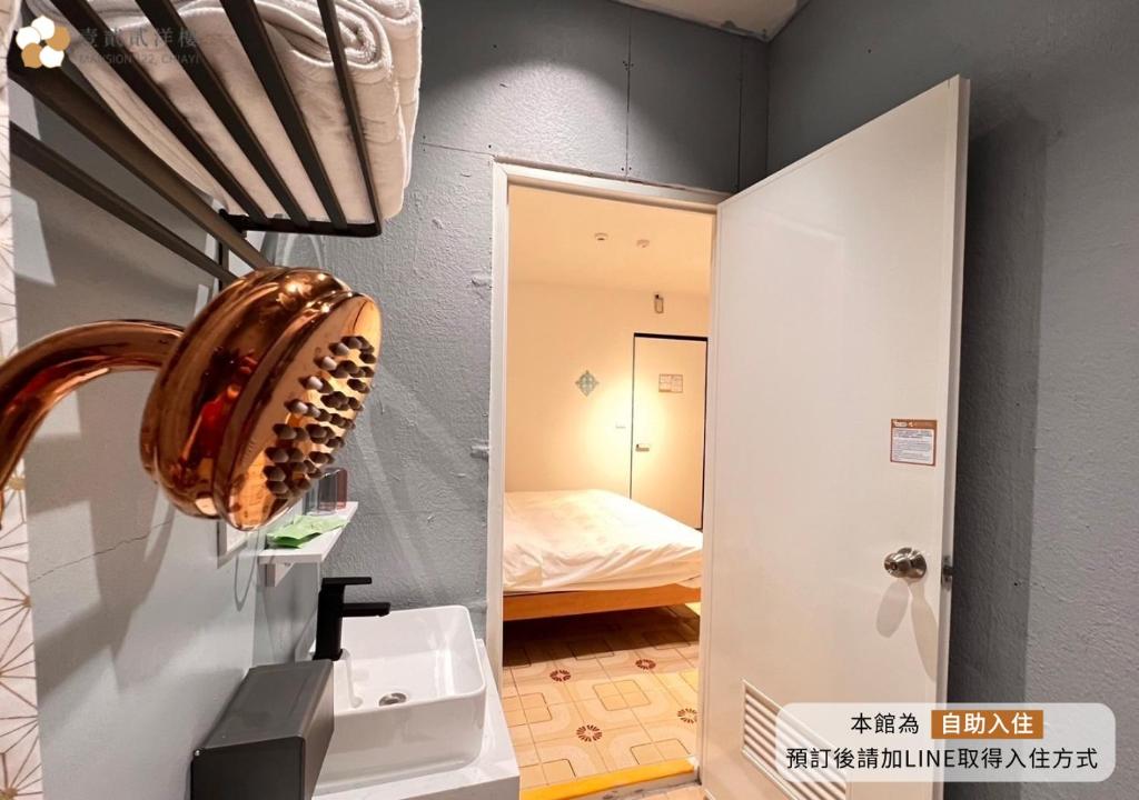 Postel nebo postele na pokoji v ubytování 壹貳貳洋樓 l 自助入住 l 無人櫃檯
