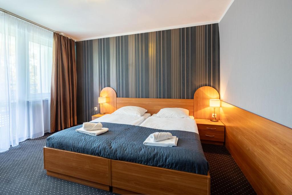 Łóżko lub łóżka w pokoju w obiekcie Baltic Inn