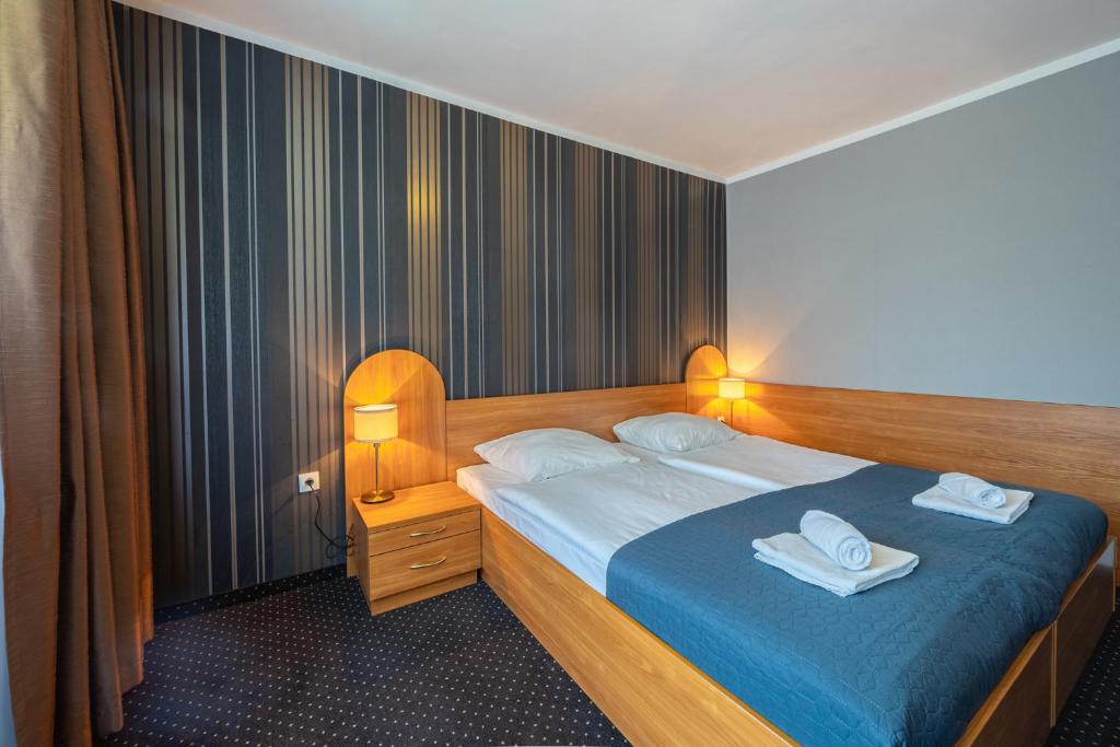 Łóżko lub łóżka w pokoju w obiekcie Baltic Inn