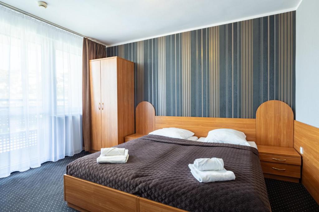 Łóżko lub łóżka w pokoju w obiekcie Baltic Inn