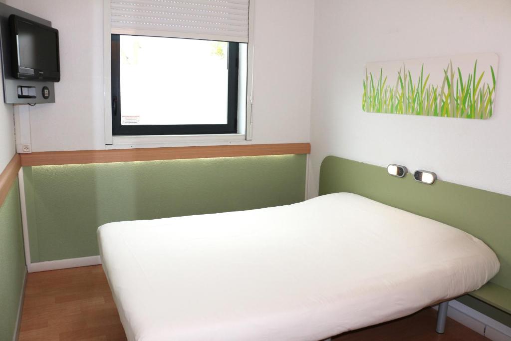 Postel nebo postele na pokoji v ubytování ibis budget Castelnaudary - A61